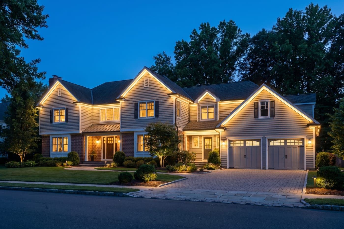 AI design preview of a two-story home at dusk with warm permanent lighting along every roofline